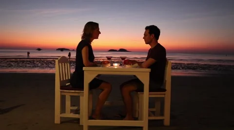 Beautiful romantic dinner on the beach in luxury restaurant, Stock Footage 59739994