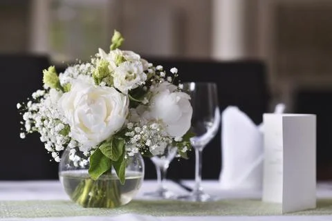 Beautiful romantic wedding table setting with white flower bouquet Stock Photos