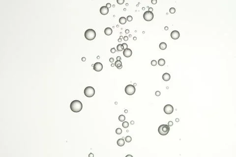 Beautiful round air bubbles flows over a light background Stock Photos