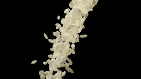 Beautiful round grain rice falling in slow motion Stock Footage 151109004