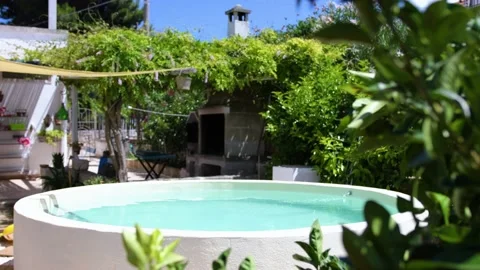 Beautiful round pool surrounded Stock Footage 141306763