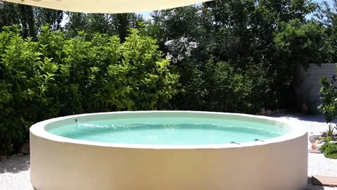 Beautiful round pool surrounded Stock Footage 141307680