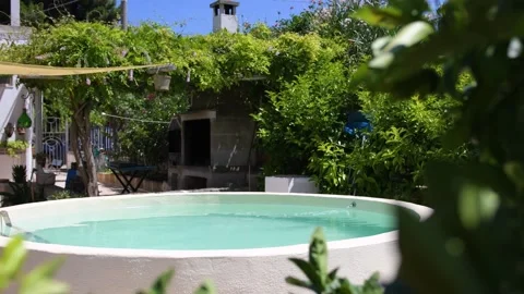 Beautiful round pool surrounded Stock Footage 141309092