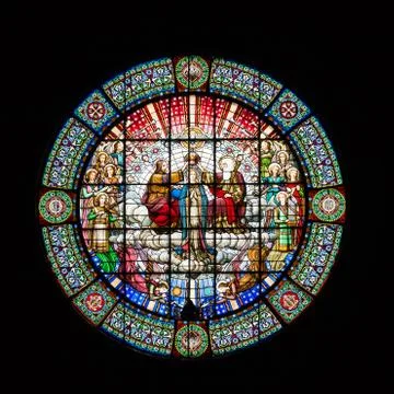 A beautiful round stained glass window in the monastery of Montserrat on a black Stock Photos