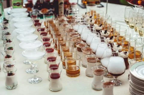 Beautiful row line of different colored alcohol cocktails on a party, Whisky Stock Photos