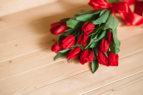 Beautiful Rustic background with Red Tulips. Colorful Card for Mothers Day Foto stock