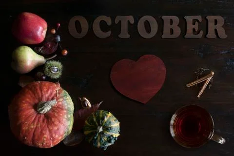 Beautiful rustic fall flat lay with leaves, pumpkins, chestnuts, cup of tea Stock Photos