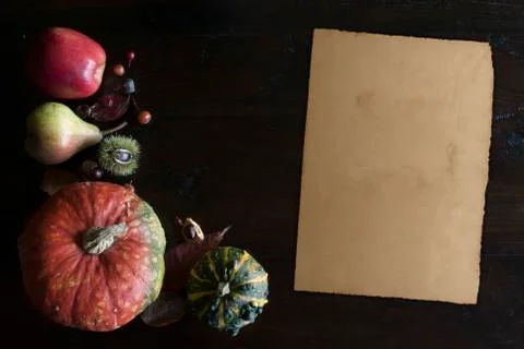 Beautiful rustic fall flat lay with leaves, pumpkins, chestnuts vintage paper Stock Photos