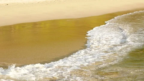 Beautiful sand beach with soft wave in sea water sunny day Stock Footage 90463139