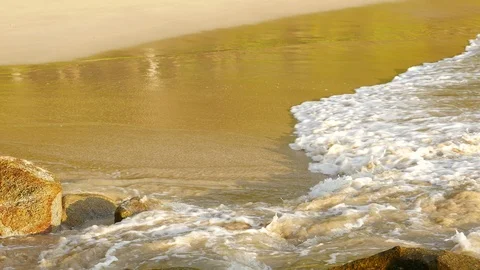 Beautiful sand beach with soft wave hit the rock, sea water sunny day Stock Footage 90464017