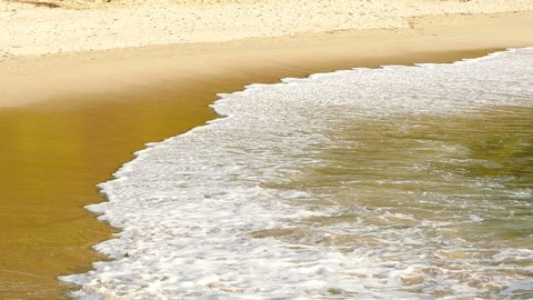 Beautiful sand beach with soft wave in sea water sunny day Stock Footage 90465805