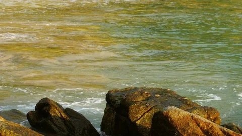 Beautiful sand beach with soft wave hit the rock, sea water sunny day Stock Footage 90466769