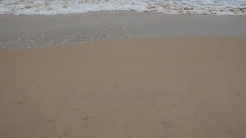 Beautiful sand beach with soft wave in sea water , cloudy rainy sky day Stock-Footage 94499206