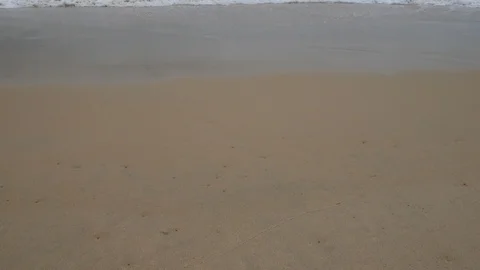 Beautiful sand beach with soft wave in sea water , cloudy rainy sky day Stock-Footage 94500375
