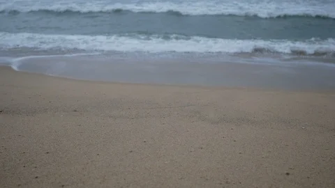 Beautiful sand beach with soft wave in sea water , cloudy rainy sky day Stock-Footage 94517218