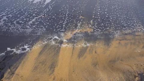 Beautiful sand pattern formed by yellow and black grains Foto stock