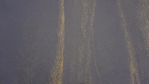 Beautiful sand pattern formed by yellow and black grains Foto stock
