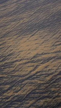 Beautiful sand pattern formed by yellow and black grains 写真素材