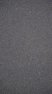 Beautiful sand pattern formed by yellow and black grains Foto stock
