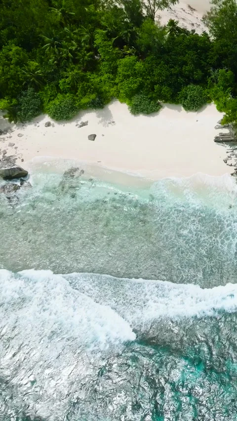 Beautiful sandy beach and ocean with waves. Seychelles. Stock Footage 304843675