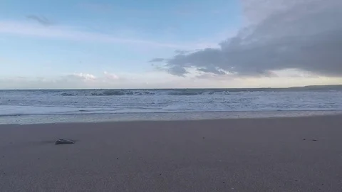 Beautiful sandy beach and wave flooding the beach, blue sky and clouds Stock Footage 78158720