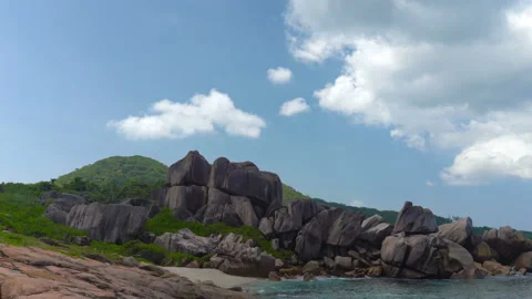 Beautiful sandy beach with blue sky and ocean waves on an exotic island Stock Footage 108646505