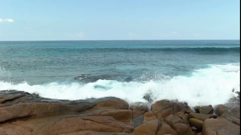 Beautiful sandy beach with blue sky and ocean waves on an exotic island Stock Footage 108646653