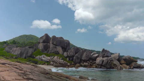 Beautiful sandy beach with blue sky and ocean waves on an exotic island Stock Footage 108647535