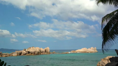 Beautiful sandy beach with blue sky and ocean waves on an exotic island Stock Footage 110041702