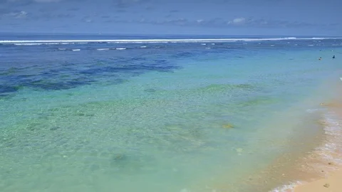 Beautiful sandy beach with clear transparent water and small waves Stock Footage 115035526
