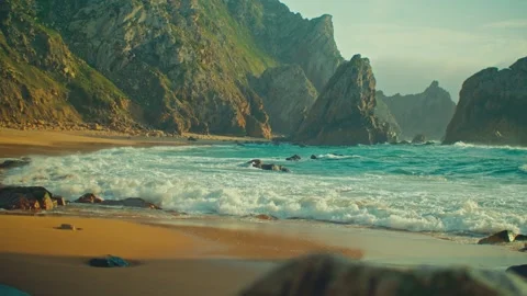 Beautiful sandy beach surrounded by cliffs on the Atlantic Ocean coast Stock Footage 329695683