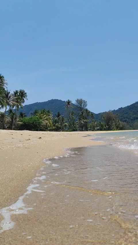 Beautiful sandy beach, waves crashing on the shore.a sunny day. idyll and Stock Footage 318078213