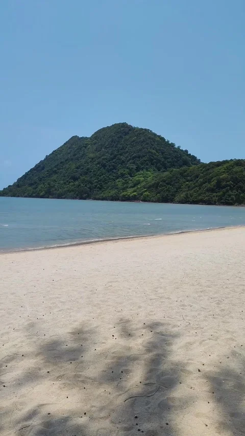 Beautiful sandy beach, waves crashing on the shore.a sunny day. idyll and Stock Footage 318078807