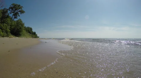Beautiful Sandy Beach as waves lap up on the Lake Michigan Shore Stock Footage 52479509