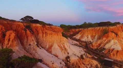Beautiful sandy cliffs and forest at sunset Portugal Aerial view Stock Footage 58949814