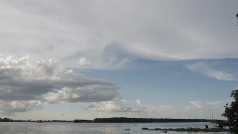Beautiful scattered clouds and blue sky over the river Stock Footage 107290759