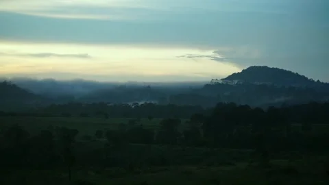 Beautiful scene of mist flowing through the mountainous landscape in Thailand. Stock Footage 309979776
