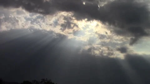 Beautiful scene of sun shining through dark clouds Stock Footage 40833830