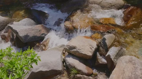 Beautiful scenery of a clear river flowing through mountain rocks Stock Footage 332866142