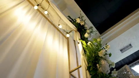 Beautiful scenery with light bulbs and wooden arch. Wedding ceremony Stock Footage 264058799