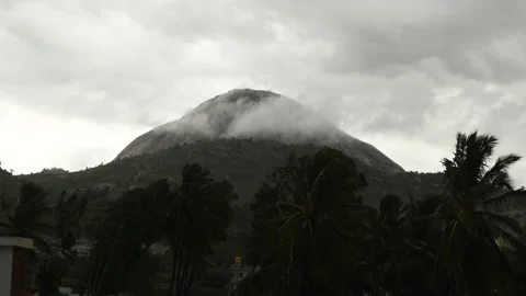 Beautiful scenery of mountain with floating clouds and fog with wind Stock Footage 156062410