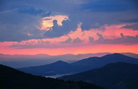 Beautiful scenery of mountain range after rain at the sunset Stock Photos