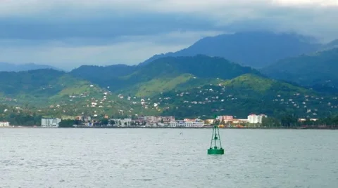 Beautiful scenery: small waves of the Pacific Ocean, mountains in the distance Stock Footage 67521838