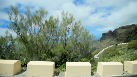 Beautiful scenery , view from a window of a moving car. mountains and clouds on Stock-Footage 107883620