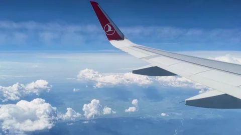 Beautiful scenic blue sky backdrop from an airplane cabin. 스톡 동영상 336930762