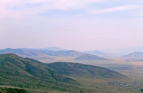 Beautiful scenic clouds on mountain landscape Sayany Stock Photos