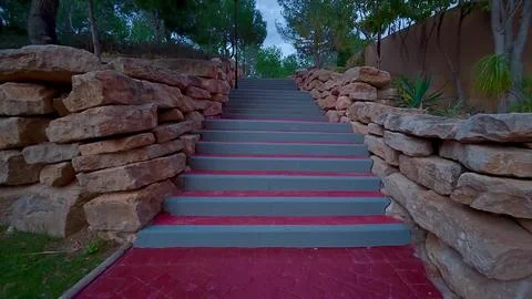 A beautiful scenic pathway featuring steps that are surrounded by stunning .. Stock Photos