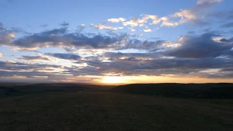 Beautiful scenic sunset with rays of sun shining through clouds 4K Stock Footage 186676961