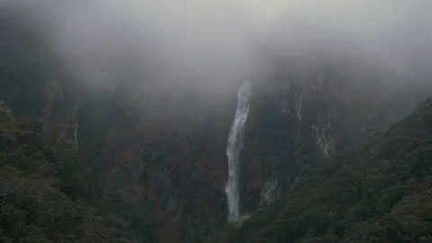 Beautiful scenic view of misty Devils Punchbowl Waterfall. Slow Motion. 4K. Stock Footage 143368846