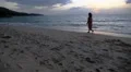 Beautiful Sea Beach and Feminine Woman in Dress. Slow Motion. HD Footage